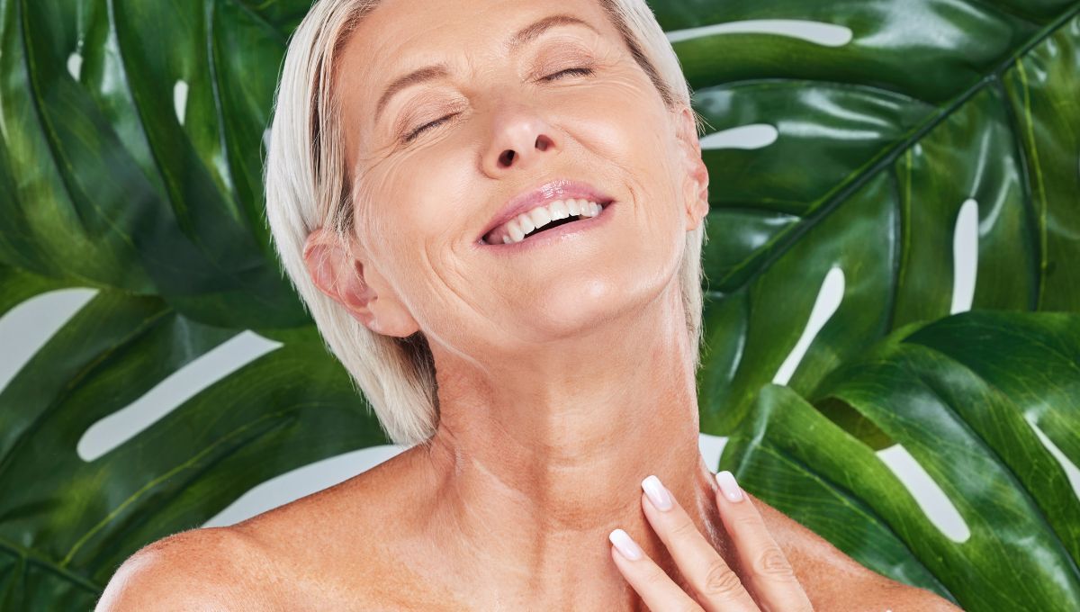 Middle aged woman massaging her neck